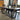 Wooden Whale Workshop metal U-leg style dining table with a wooden tabletop and sleek metal U-shaped legs.