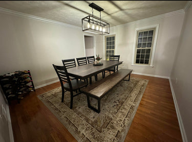 Metal U-leg wooden dining table by Wooden Whale Workshop with a sturdy tabletop and modern U-shaped metal legs.