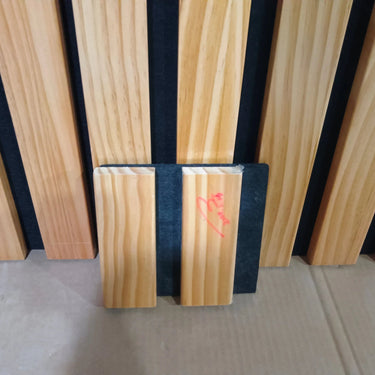 HAUSVITA broad strip wood panels sample box with four color options, showing different wood grain textures and finishes.