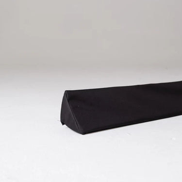 Foam triangle wedge protection pelmet in white for home safety, designed to cushion corners and prevent injuries.