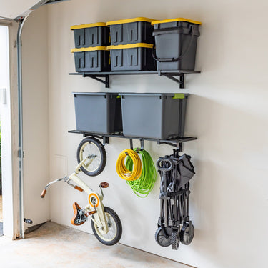 Pair of StoreYourBoard 1' x 4' Bristol garage wall mount shelves for organized storage in a garage setting.