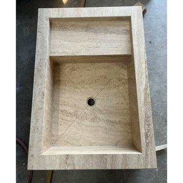 Handcrafted custom travertine kitchen sink by Luvohome, featuring natural stone texture and elegant design.