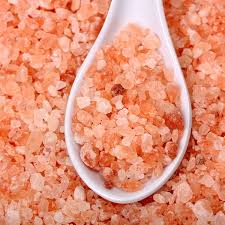 Large pile of 1100 pounds of pink Himalayan bath salts from Black Tai Salt Co. in a natural, coarse crystal form.