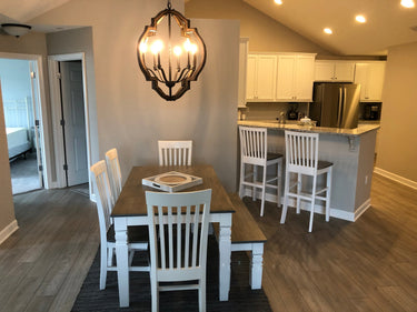 Tall Mission Chair by Wooden Whale Workshop featuring a wooden frame and classic design, shown from a side angle.