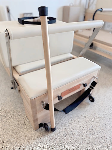 Personal Hour Pilates wooden pole for reformer exercises, showcasing a smooth, natural wooden accessory for fitness workouts.