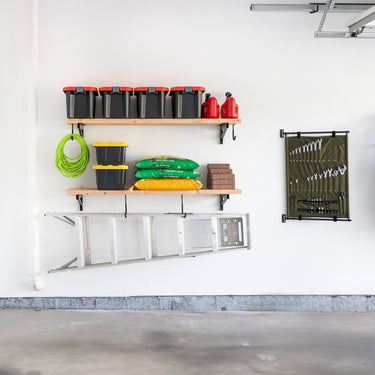 Heavy duty wall-mounted brackets for garage shelves, made of durable metal, designed to support 1' x 4' DIY wall shelves.
