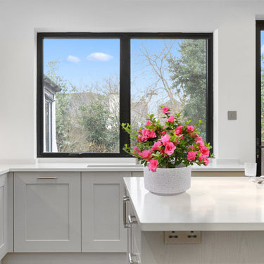 Two milk white ceramic flowerpots from HouseOfZazla's 2-piece set with smooth, rounded design for indoor plant display.