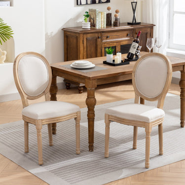 Pair of French style solid wood frame linen back dining chairs by HouseOfZazla, showcasing elegant design and comfortable seating.