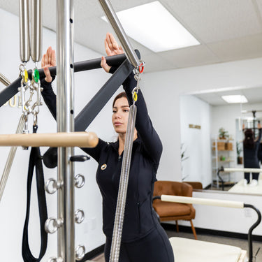 Personal Hour Nano Elite Half Trapeze Pilates Reformer with adjustable tower for studio Pilates workouts.