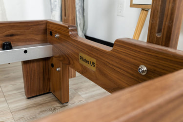 Nano La Force Plus premium walnut studio reformer Pilates machine by Personal Hour, featuring sleek design and adjustable resistance.