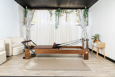 Nano La Force Plus premium walnut Pilates studio reformer by Personal Hour, showcasing the sleek reformer with adjustable features.