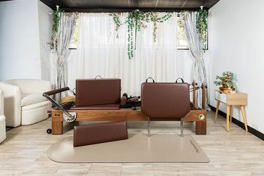 Nano La Force Plus Premium Walnut Studio Reformer Pilates machine by Personal Hour, featuring a sleek design and multiple resistance settings.