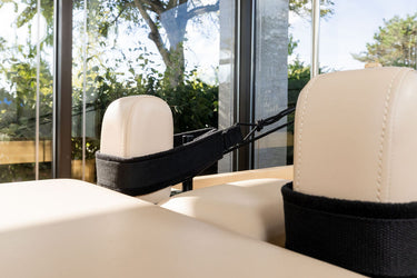 Personal Hour Napolie Clinical Plus Cadillac and Pilates Reformer machine with padded surfaces and adjustable components for fitness.