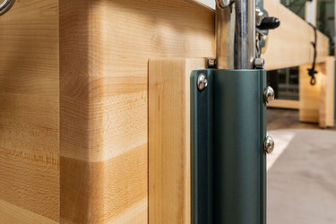 Personal Hour Napolie Clinical Plus Cadillac and Pilates Reformer machine with adjustable springs and padded surfaces for Pilates exercises.