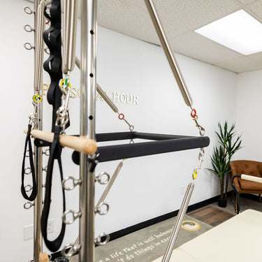 Personal Hour Pilates springs set showing adjustable resistance springs for Pilates exercises and strength training.