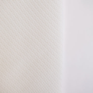 Commercial archery impact screen by GolfbaysUSA with baffle design, used for golf simulator setups to catch and display golf balls.