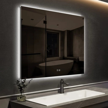 Sleek backlit LED bathroom mirror by HAUSVITA with a compact design and modern frame, reflecting in a bathroom setting.