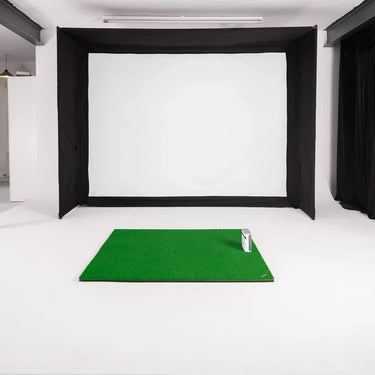 GolfBays EasySim golf simulator enclosure from GolfbaysUSA, showing a spacious, black golf enclosure with netting and frame structure.