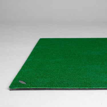 GolfbaysUSA standard golf hitting mat measuring 4'11" x 4'11" with a textured surface and realistic turf for practice.