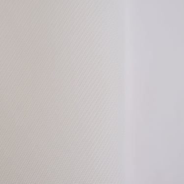 Impact screen with foam layer backing from GolfbaysUSA, showing a close-up of the textured foam surface and durable screen material.