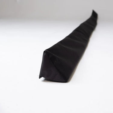 Foam triangle wedge protection pelmet from GolfbaysUSA, used for home safety and protection, shown in a close-up image.