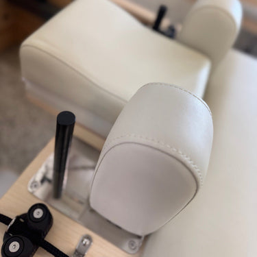 Personal Hour Pilates head and neck support pillow for yoga and Pilates, with soft cushioning for comfort during exercises.