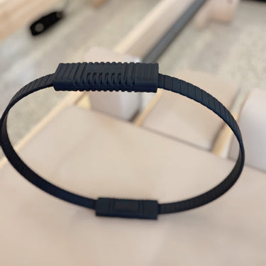 PersonalHour Pilates Magic Ring for Yoga and Pilates exercises, showing a flexible fitness ring in a neutral setting.