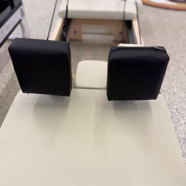 Personal Hour Pilates reformer shoulder rest pillows with cushioned support for enhanced comfort during exercises.