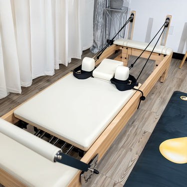Nano Pro Max Studio Pilates Reformer by Personal Hour with adjustable resistance and padded carriage for full-body workouts.