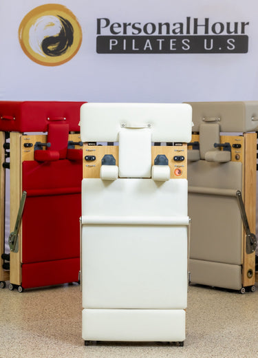 Foldable Zous Pro Pilates Reformer by Personal Hour with adjustable resistance and compact design for versatile Pilates workouts.