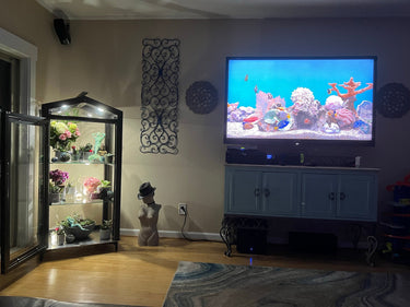 Janco greenhouse indoor/outdoor garden cabinet with glass doors and shelving for plant storage and display.