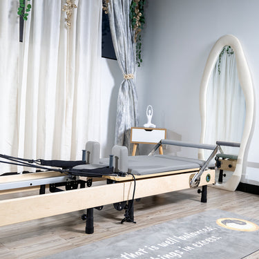 Foldable Janet Elite 2.0 Pilates Reformer by Personal Hour with adjustable resistance and compact design for home workouts.