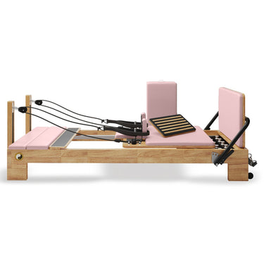 Pink Nano Pro Lite Pilates Reformer side view by Personal Hour, compact Pilates machine with adjustable resistance for home workouts.