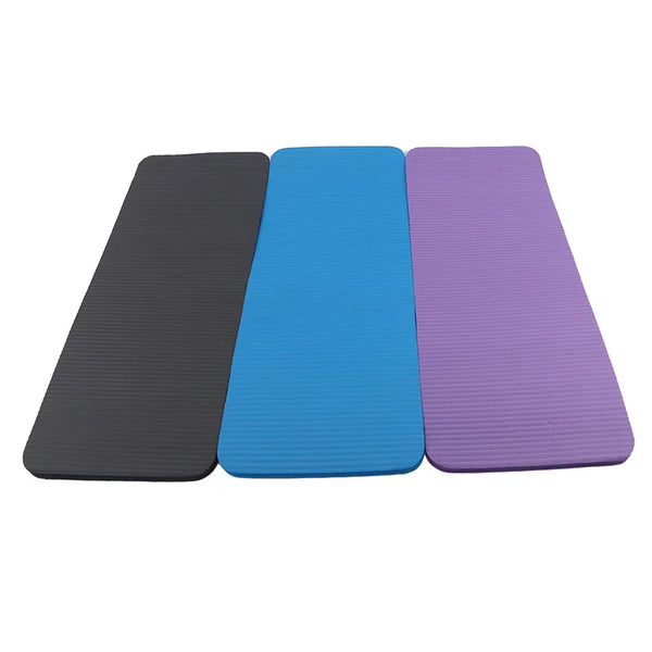 Lightweight durable fitness mat for yoga and Pilates by 24 Hour Sport, shown rolled out on a wooden floor with textured surface.