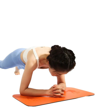 Blue compact Pilates exercise mat from 24 Hour Sport, ideal for home and gym workouts, with textured surface for grip.