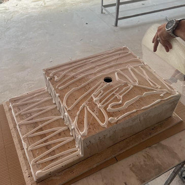 Handcrafted custom travertine kitchen sink by Luvohome, featuring a natural stone finish and durable design.