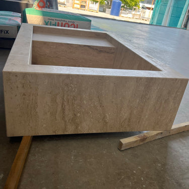 Handcrafted custom travertine kitchen sink by Luvohome, featuring a natural stone finish and elegant design.