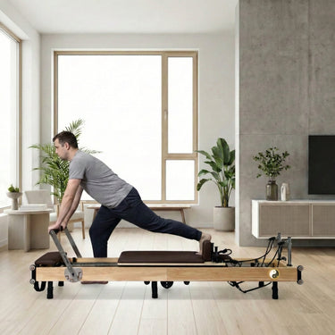 Chocolate Zous Pro foldable Pilates reformer by Personal Hour, compact Pilates machine with adjustable features and cushioned surface.