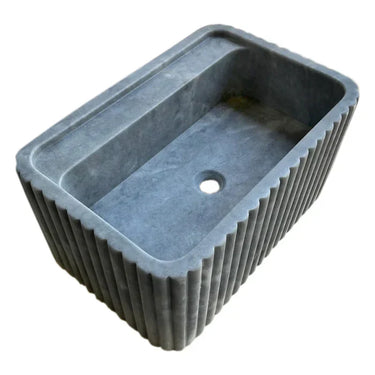 Luvohome rectangular Bluestone marble wall-mount bathroom sink with fluted design, 16x24 inches, honed finish, angle view.