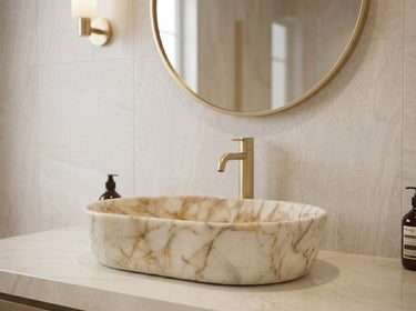 Luvohome Calacatta Gold marble above-vanity oval curved bathroom sink with polished finish, 16" wide, 24" long, 5" high.