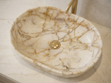 Luvohome Calacatta Gold marble oval vessel sink with polished finish, 16-inch wide, 24-inch long, 5-inch high natural stone bathroom sink