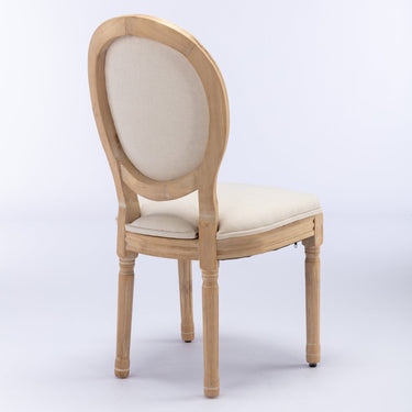 Pair of French style solid wood frame linen back dining chairs by HouseOfZazla, showcasing elegant design and comfortable seating.
