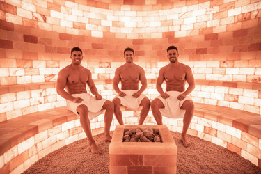 Black Tai Salt Co. Himalayan Salt Sauna, 8' x 8' surface area, showcasing the salt-covered interior and relaxing sauna environment.