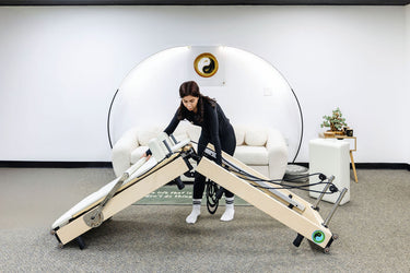 White Janet Elite 2.0 foldable Pilates reformer by Personal Hour, featuring adjustable resistance and compact design for home workouts.