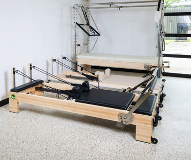 Large Personal Hour Nano Elite Plus Pilates Reformer machine for studio workouts, featuring adjustable resistance and sleek design.